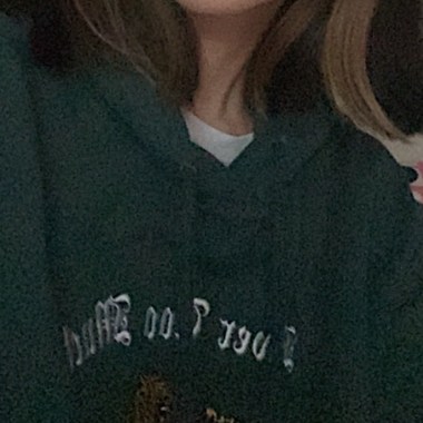 2021 wearing a green hoodie